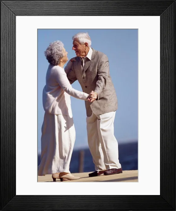 Framed Print : Senior couple dancing on a pier Framed Print : Senior couple dancing on a pier