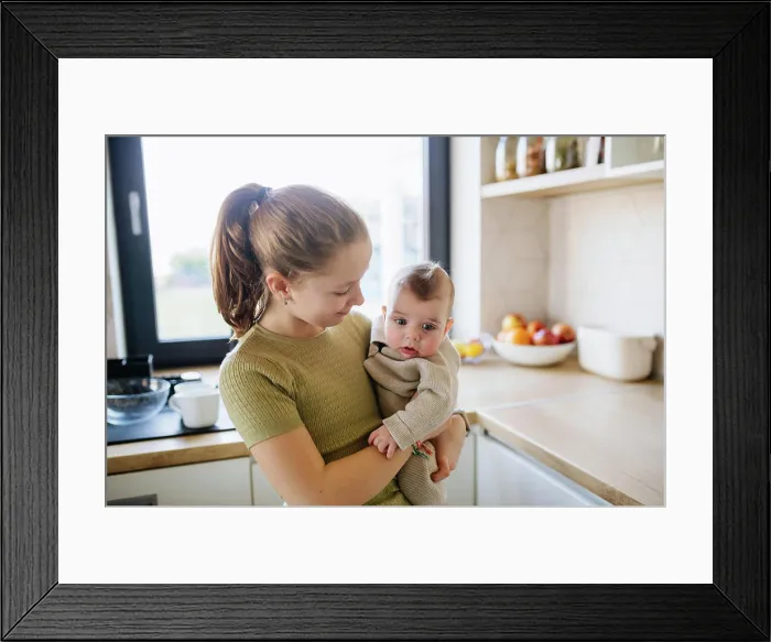Framed Print : Big sister holding in arms baby brother. Big sister holding in arms baby brother. Siblings. model released Framed Print : Big sister holding in arms baby brother. Big sister holding in arms baby brother. Siblings. model released