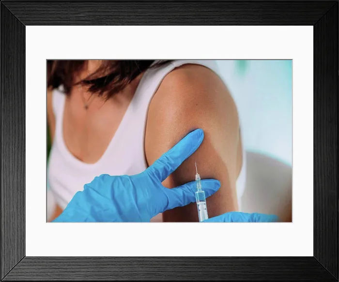 Framed Print : Woman being vaccinated Framed Print : Woman being vaccinated