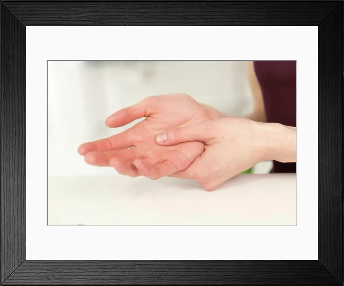 Framed Print : Woman suffering from hand pain Framed Print : Woman suffering from hand pain