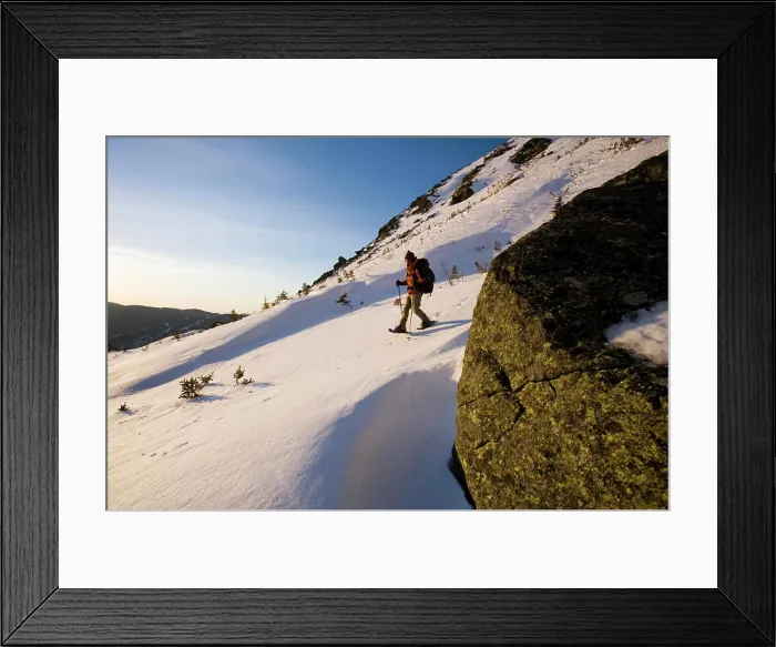 Framed Print : A man snowshoes in Tuckerman Ravine in New Hampshire's White Mountains. (MR)