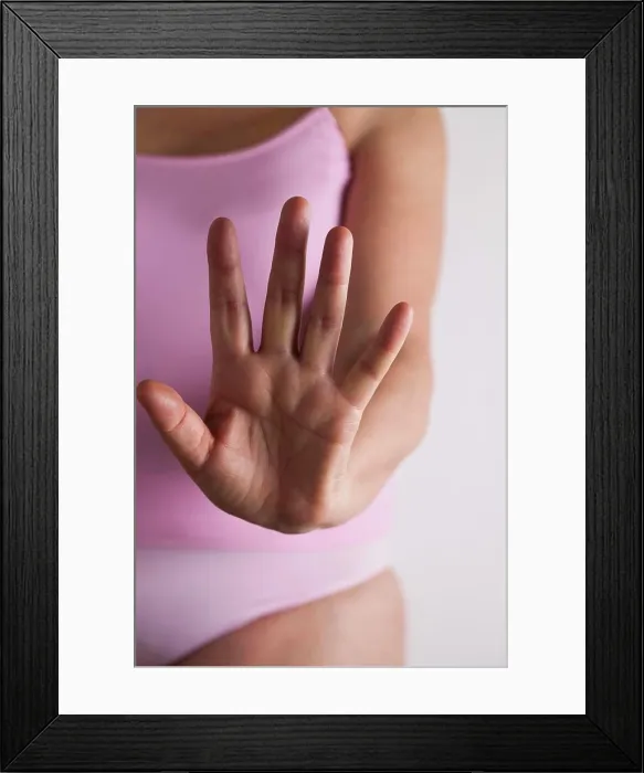 Framed Print : Woman holding hand out towards camera