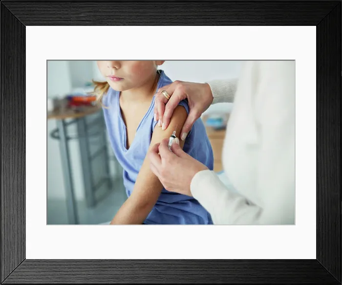 Framed Print : Vaccinating a child