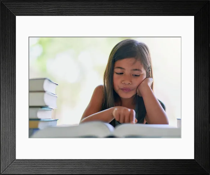 Framed Print : Child, books and reading in living room for development Framed Print : Child, books and reading in living room for development