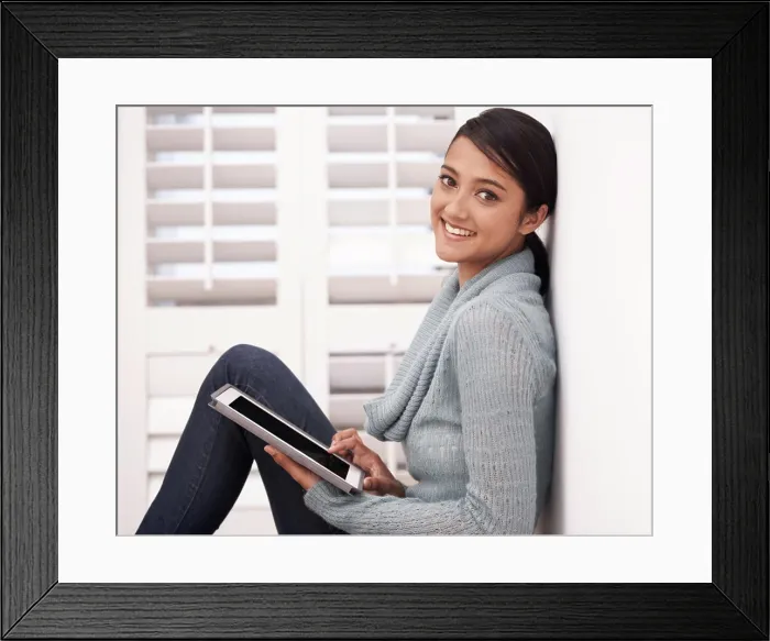 Framed Print : Portrait of girl on floor with tablet Framed Print : Portrait of girl on floor with tablet