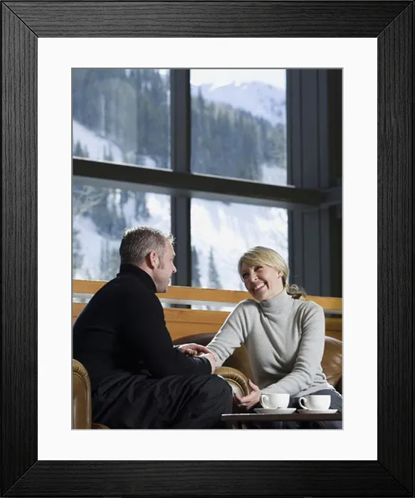 Framed Print : Man and woman chatting in a ski lodge Framed Print : Man and woman chatting in a ski lodge