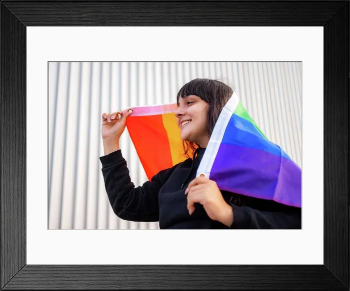 Framed Print : Portrait of a latina woman wearing the rainbow flag Framed Print : Portrait of a latina woman wearing the rainbow flag