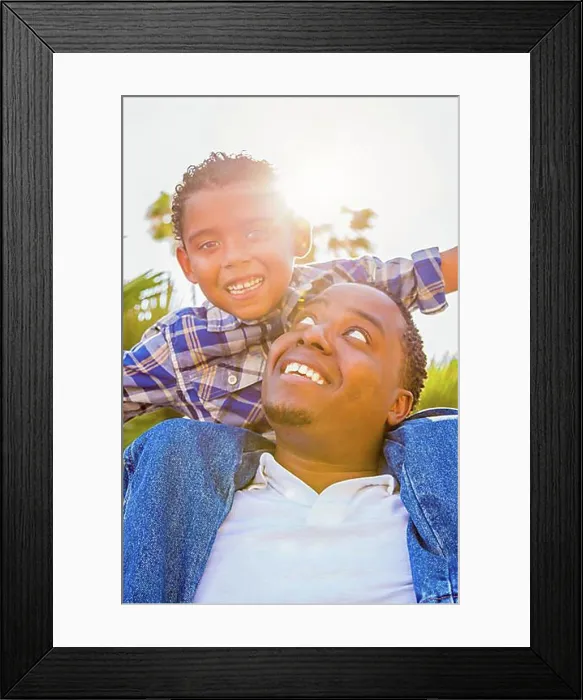 Framed Print : mixed-race son and african american father playing piggyback outdoors together Framed Print : mixed-race son and african american father playing piggyback outdoors together