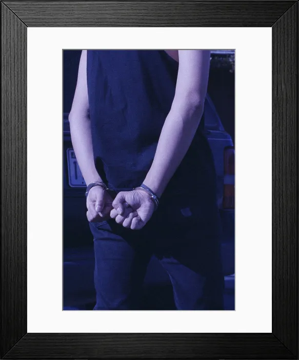 Framed Print : Rear view of a person in handcuffs Framed Print : Rear view of a person in handcuffs