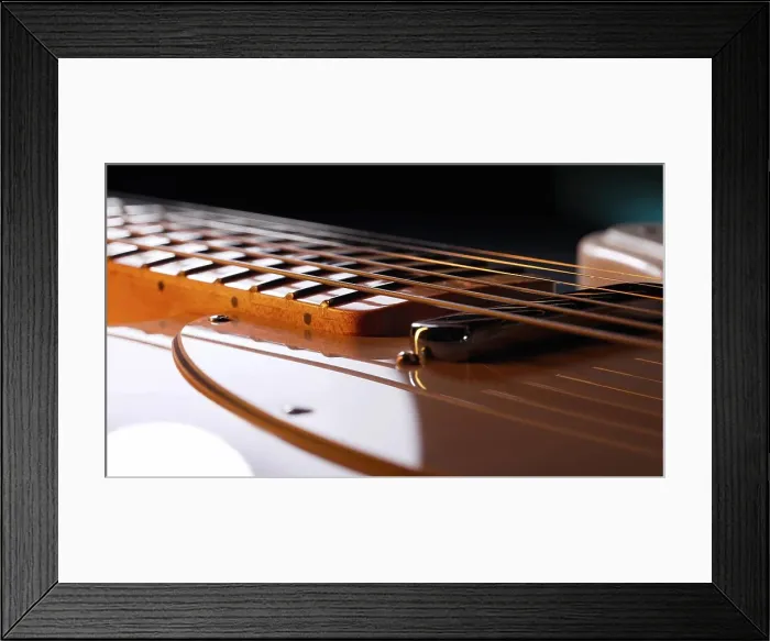 Framed Print : Macro of strings on electric guitar fretboard. Details of instrument close-up Framed Print : Macro of strings on electric guitar fretboard. Details of instrument close-up
