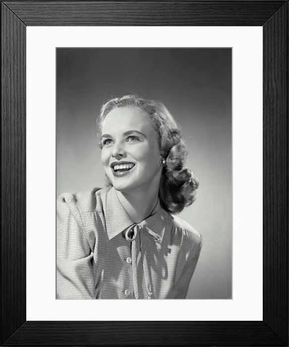 Framed Print : Vintage Photograph. Smiling blonde woman wearing button up blouse with knot tied on collar Framed Print : Vintage Photograph. Smiling blonde woman wearing button up blouse with knot tied on collar