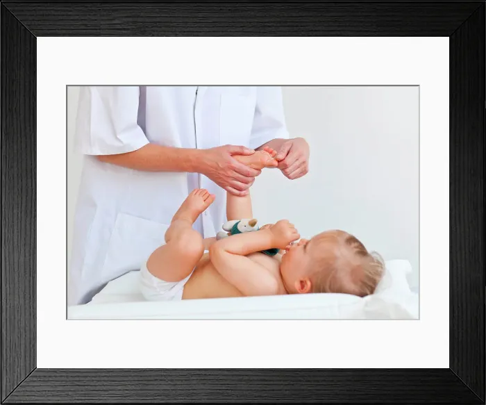 Framed Print : 17 months old baby receiving foot massage