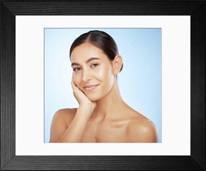 Framed Print : Portrait, skincare and beauty with a model woman in studio on a blue background for natural treatment