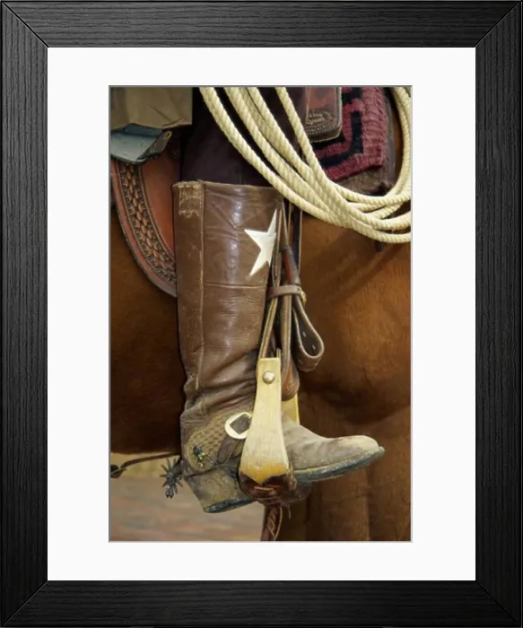 Framed Print : Low section view of a cowboy riding a horse