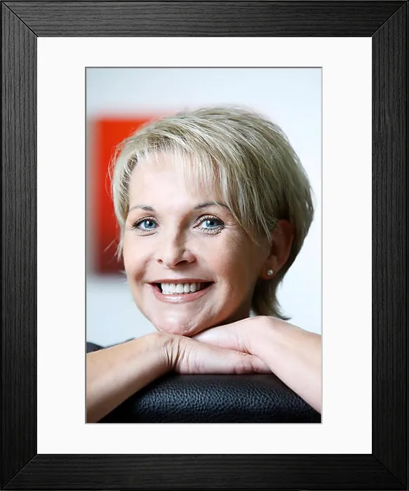 Framed Print : Portrait of a woman, early 40s, in personal setting, looking at the camera, smiling Framed Print : Portrait of a woman, early 40s, in personal setting, looking at the camera, smiling
