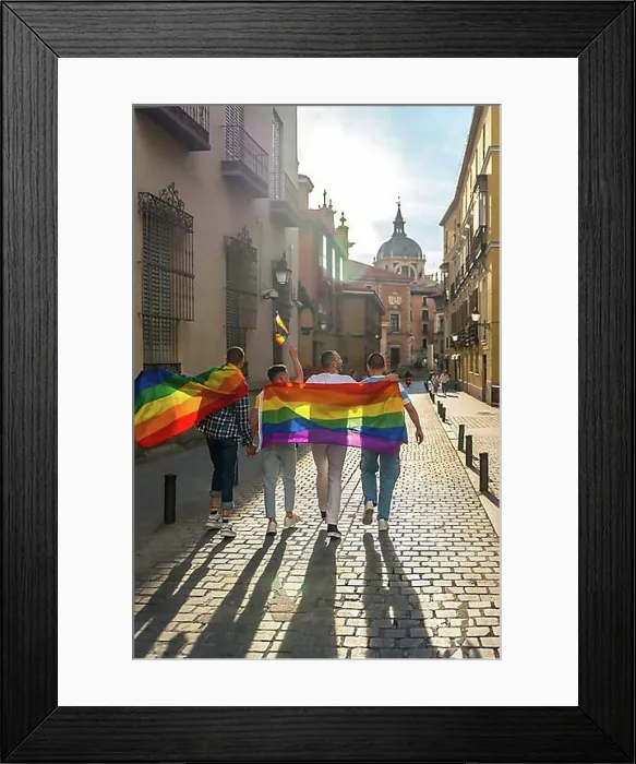 Framed Print : Man with his back facing the demonstration with the rainbow flags, gay pride party in the city, lgbt concept Framed Print : Man with his back facing the demonstration with the rainbow flags, gay pride party in the city, lgbt concept