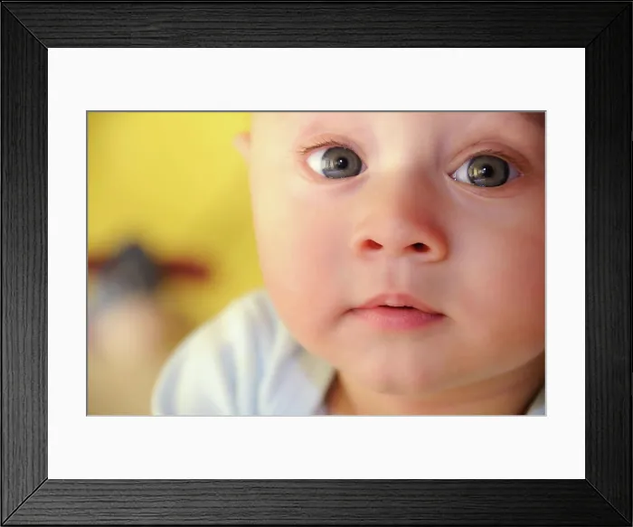 Framed Print : baby in the foreground facing forward baby in the foreground facing forward with yellow background