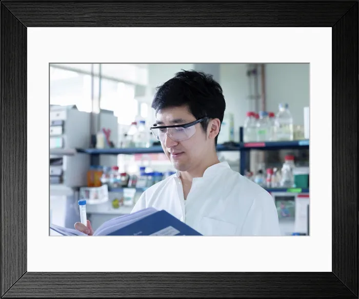 Framed Print : young scientist male chinese working in laboratory Framed Print : young scientist male chinese working in laboratory