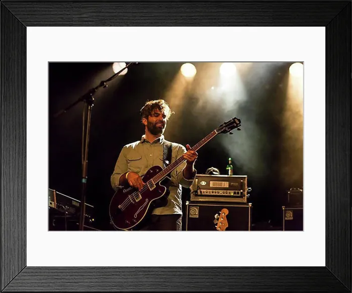 Framed Print : Bassist Martin Kuenzle from the Swiss band Signori Misteriosi performing live in the Schueuer concert hall