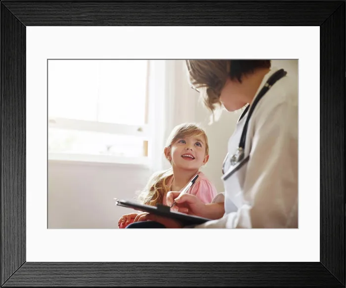 Framed Print : Child doctor, girl and talking trust with medical checklist in a hospital for wellness and health Framed Print : Child doctor, girl and talking trust with medical checklist in a hospital for wellness and health