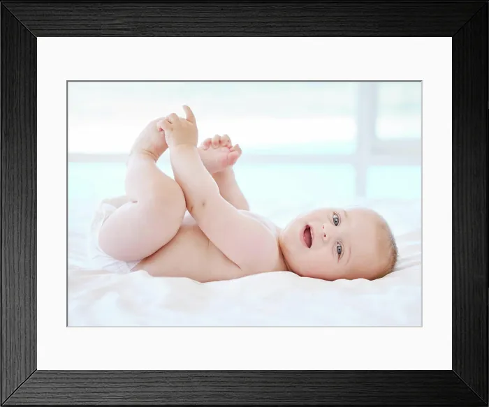 Framed Print : Happy, baby and portrait on bed for game Framed Print : Happy, baby and portrait on bed for game