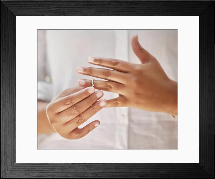 Framed Print : Hands, removing and wedding ring in divorce Framed Print : Hands, removing and wedding ring in divorce