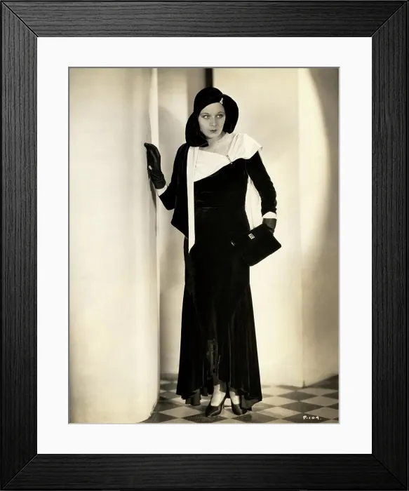 Framed Print : Young woman in elegant dress posing in corridor, 1931