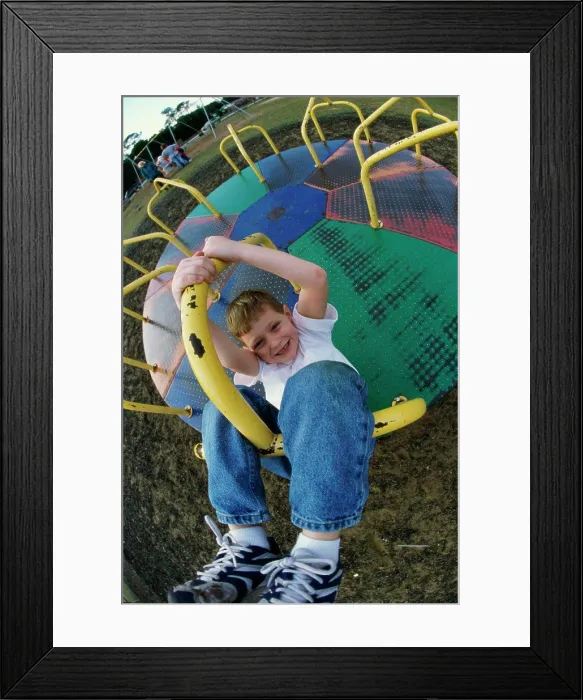 Framed Print : Portrait of a boy on a merry-go-round Framed Print : Portrait of a boy on a merry-go-round