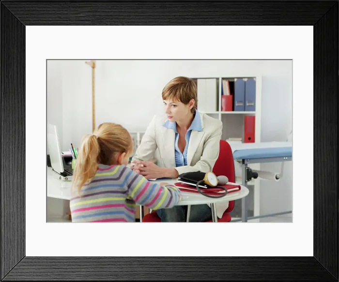 Framed Print : Child in consultation