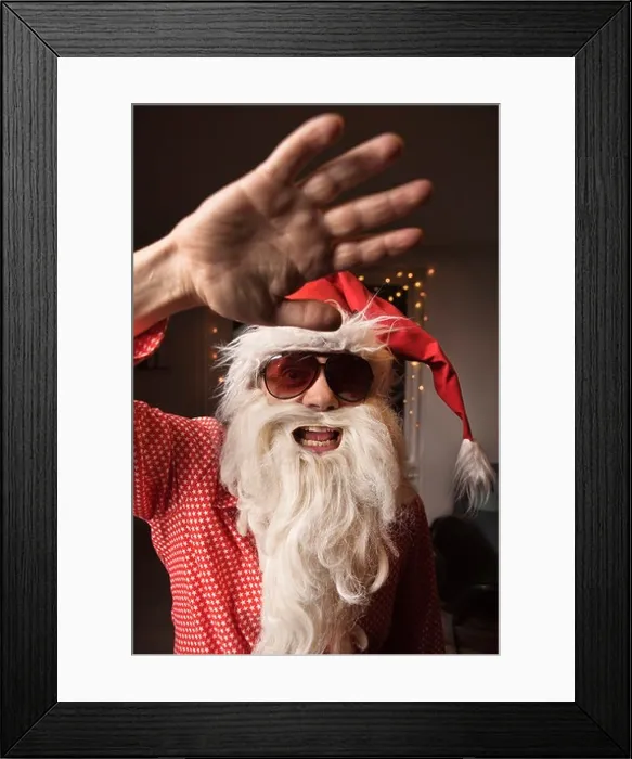 Framed Print : Man wearing Santa Claus hat and beard Framed Print : Man wearing Santa Claus hat and beard
