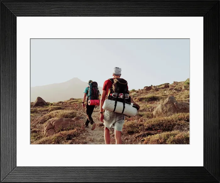 Framed Print : Two men walk on trail with camping gear and Mount Teide in background Framed Print : Two men walk on trail with camping gear and Mount Teide in background