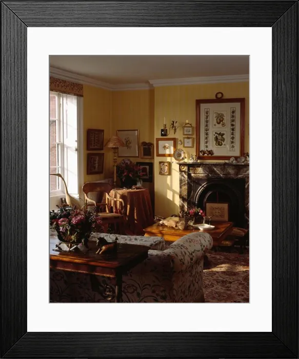 Framed Print : Group of pictures on wall in traditional living room Framed Print : Group of pictures on wall in traditional living room
