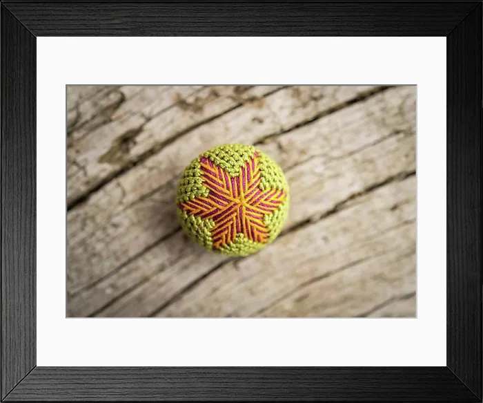 Framed Print : Colorful Posamentenknopf, unique regional handicraft, on wooden panel