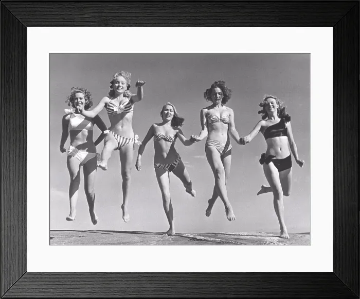 Framed Print : 1940s summer. A group of young women in their bikinis are happy on this summer's day Framed Print : 1940s summer. A group of young women in their bikinis are happy on this summer's day