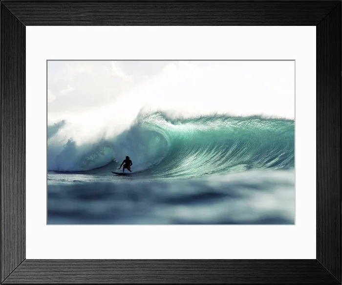 Framed Print : Hawaii, Oahu, North Shore, Silhouette of a surfer inside the barrel of a large wave. Editorial Use Only