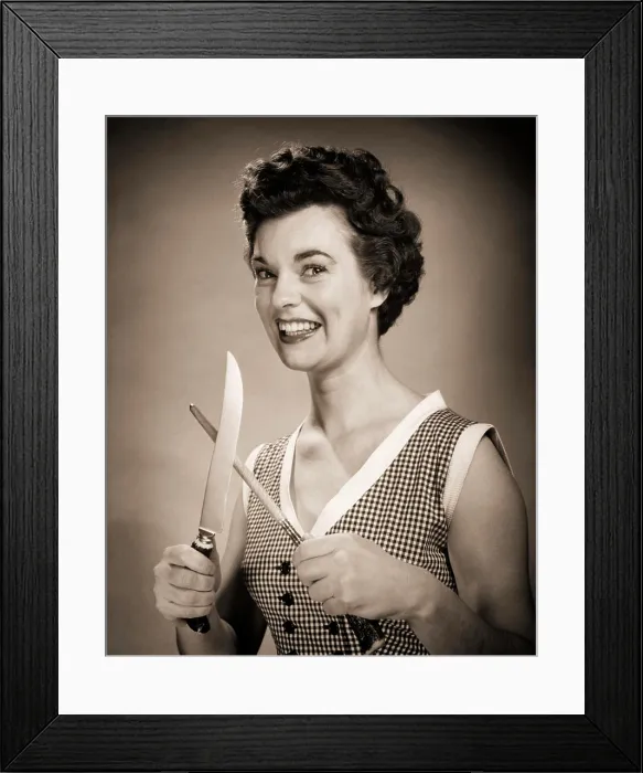 Framed Print : 1950s SMILING EAGER WOMAN HOUSEWIFE HOLDING SHARPENING CARVING KNIFE LOOKING AT CAMERA