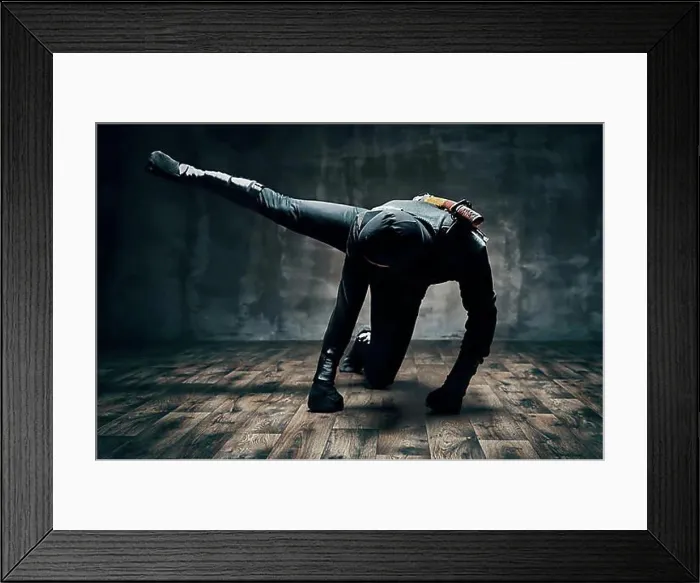 Framed Print : Ninja making fighting moves kicking and punching with leg over black background. japanese fighter concept