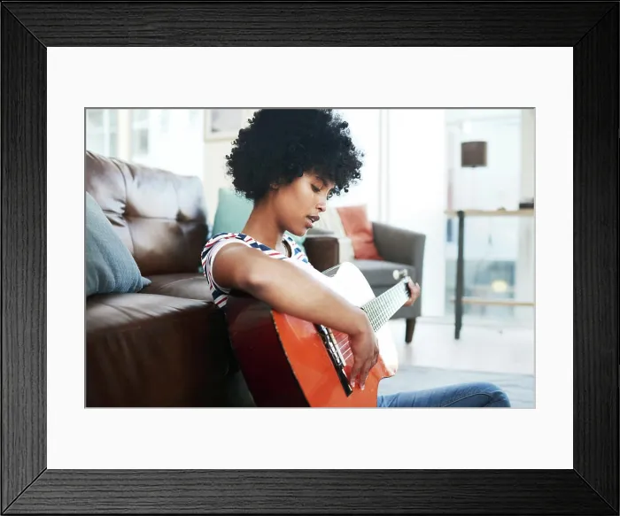 Framed Print : Woman, musician and playing on guitar strings at home for music Framed Print : Woman, musician and playing on guitar strings at home for music