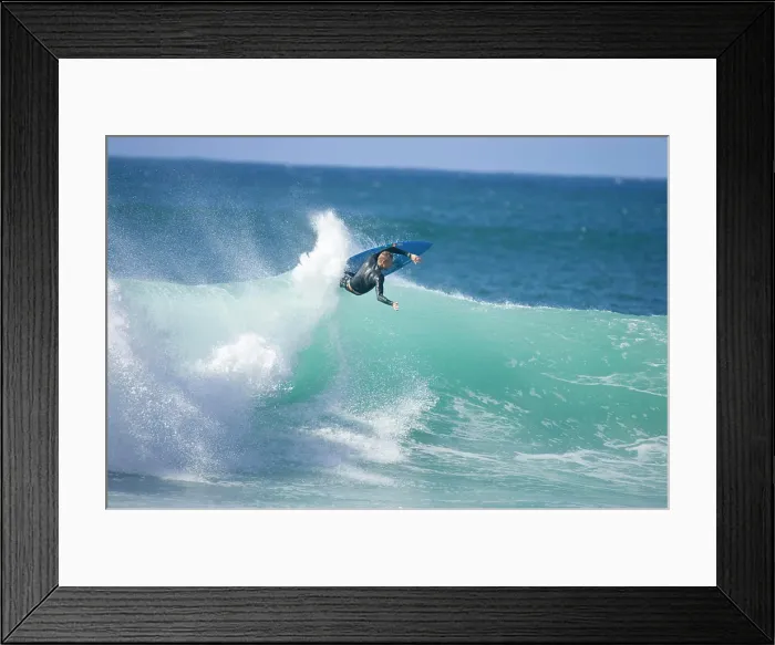 Framed Print : A young man surfing at Rocky Point on the north shore of Oahu, Hawaii Framed Print : A young man surfing at Rocky Point on the north shore of Oahu, Hawaii