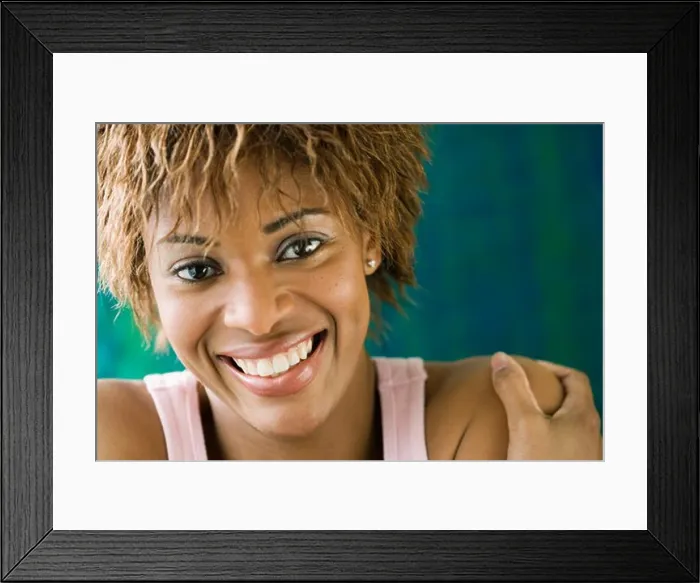 Framed Print : Portrait of a young woman smiling Framed Print : Portrait of a young woman smiling