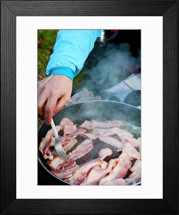 Framed Print : woman frying bacon during picnic in south Wales Framed Print : woman frying bacon during picnic in south Wales