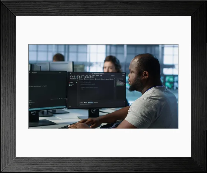 Framed Print : Ill Admin programming in server room housing advanced equipment coming up with flu Framed Print : Ill Admin programming in server room housing advanced equipment coming up with flu