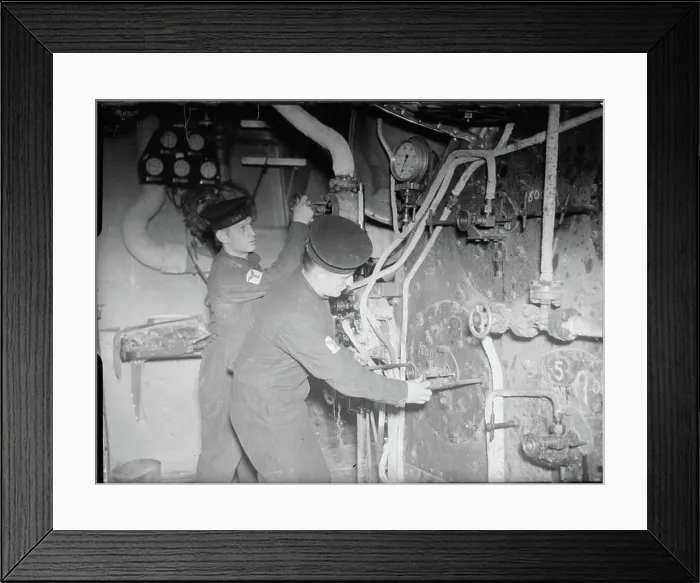 Framed Print : The Royal Navy during the Second World War A scene in the boiler room of a cruiser showing two stokers checking Framed Print : The Royal Navy during the Second World War A scene in the boiler room of a cruiser showing two stokers checking