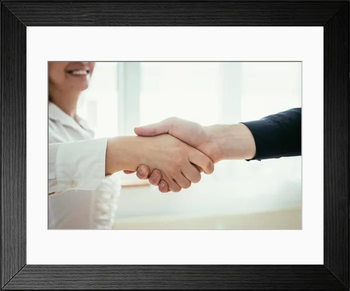 Framed Print : Shaking hands, concept for teamwork: Close up of man and woman shaking hands in the office Framed Print : Shaking hands, concept for teamwork: Close up of man and woman shaking hands in the office