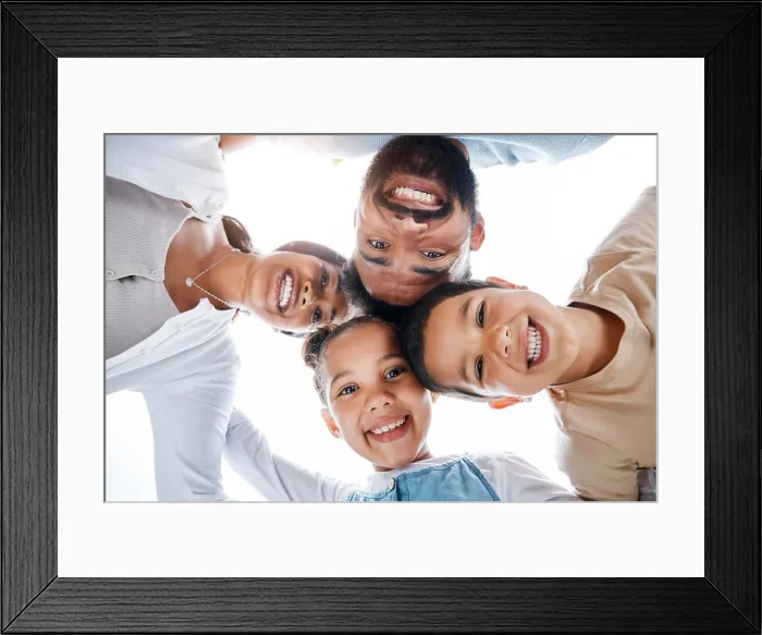 Framed Print : Huddled family bonding, laughing and having fun while standing in a circle with heads in the middle Framed Print : Huddled family bonding, laughing and having fun while standing in a circle with heads in the middle
