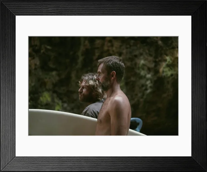 Framed Print : Man with a surfboard goes to the Uluwatu surf spot Framed Print : Man with a surfboard goes to the Uluwatu surf spot