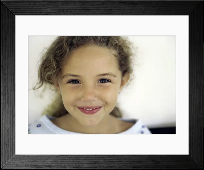 Framed Print : Portrait of a girl smiling Framed Print : Portrait of a girl smiling