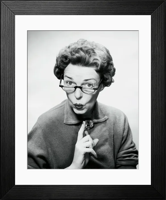 Framed Print : Close-up of a mid adult woman puckering her lips Framed Print : Close-up of a mid adult woman puckering her lips