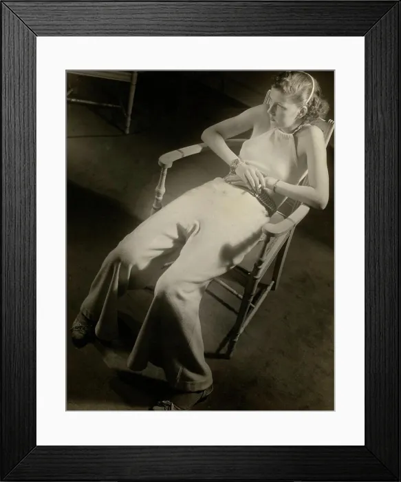 Framed Print : Fashion model sitting in armchair in elegant clothing