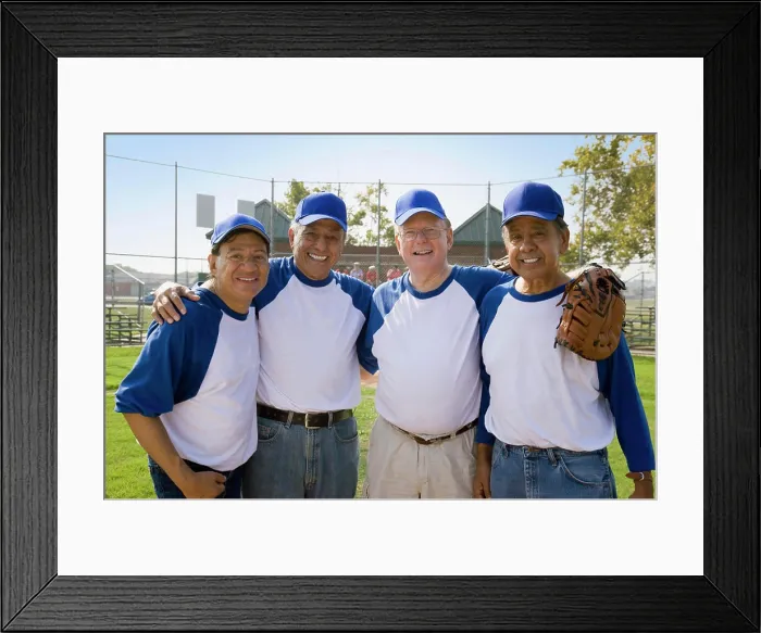 Framed Print : Senior men playing on baseball team